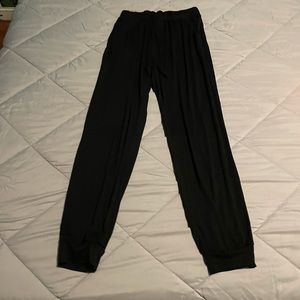 Black cotton lounge pants with side pockets and drawstring